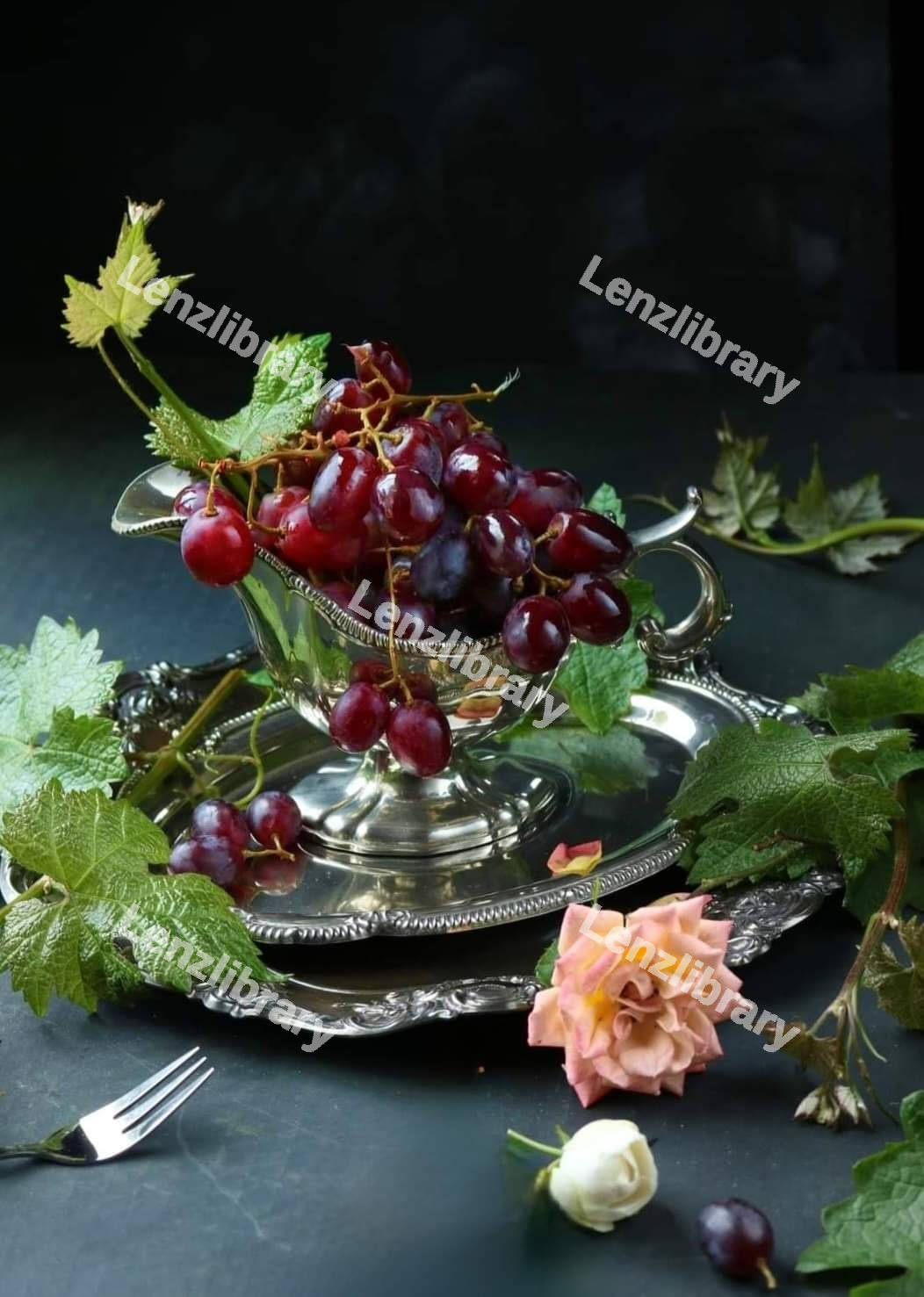 Red grapes placed on silver dishes